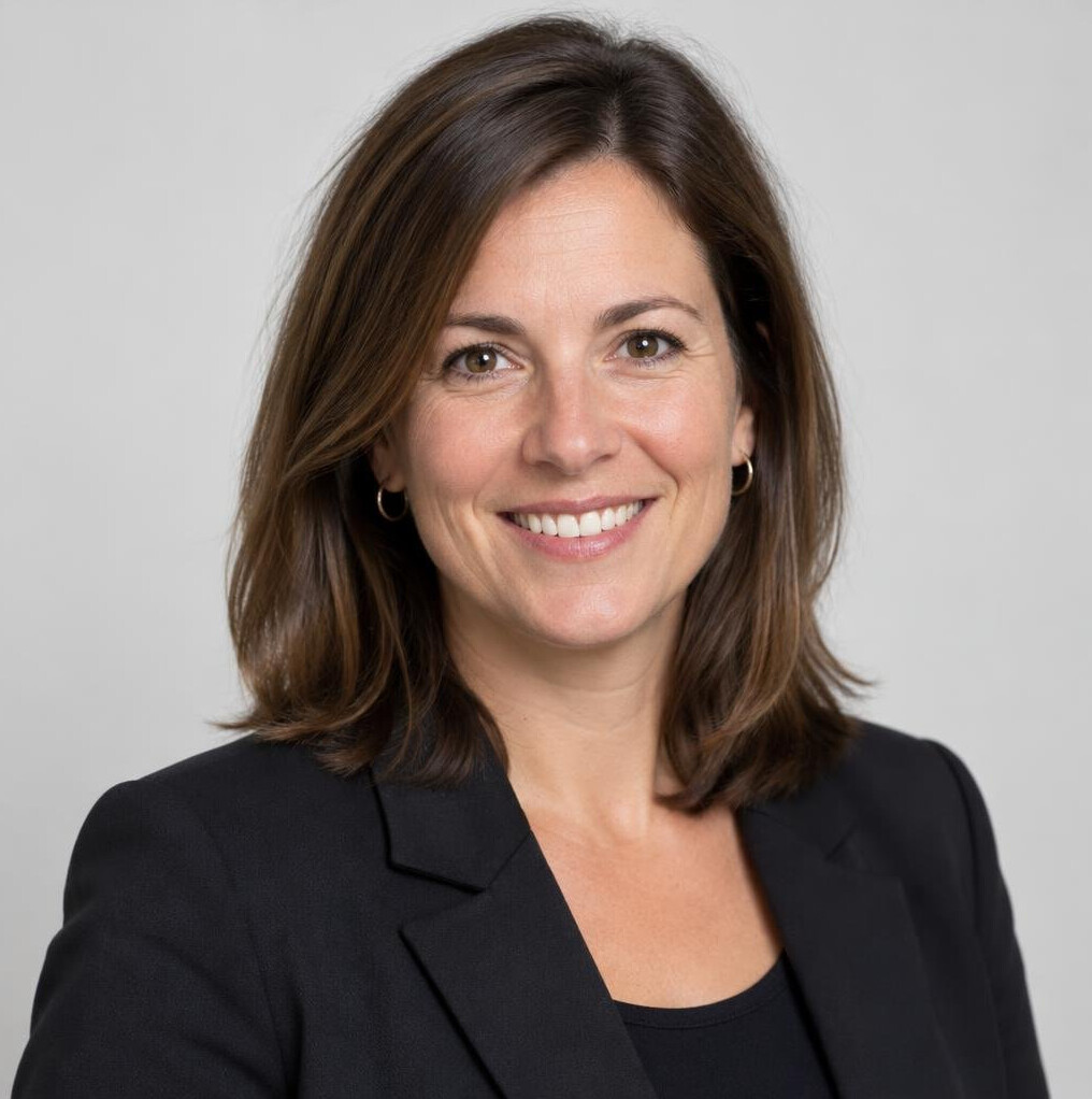 Portrait of a smiling woman with shoulder-length brown hair