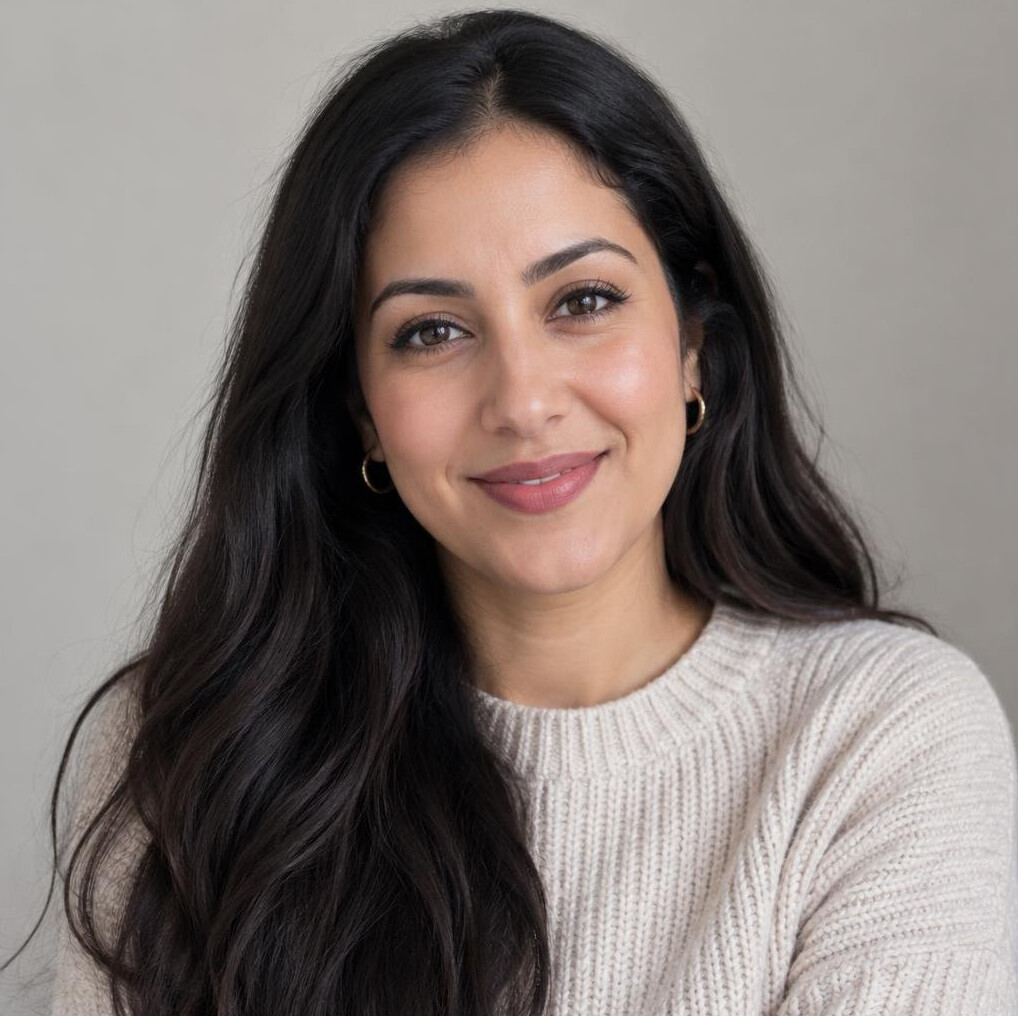 Portrait of a woman with long hair and a friendly expression